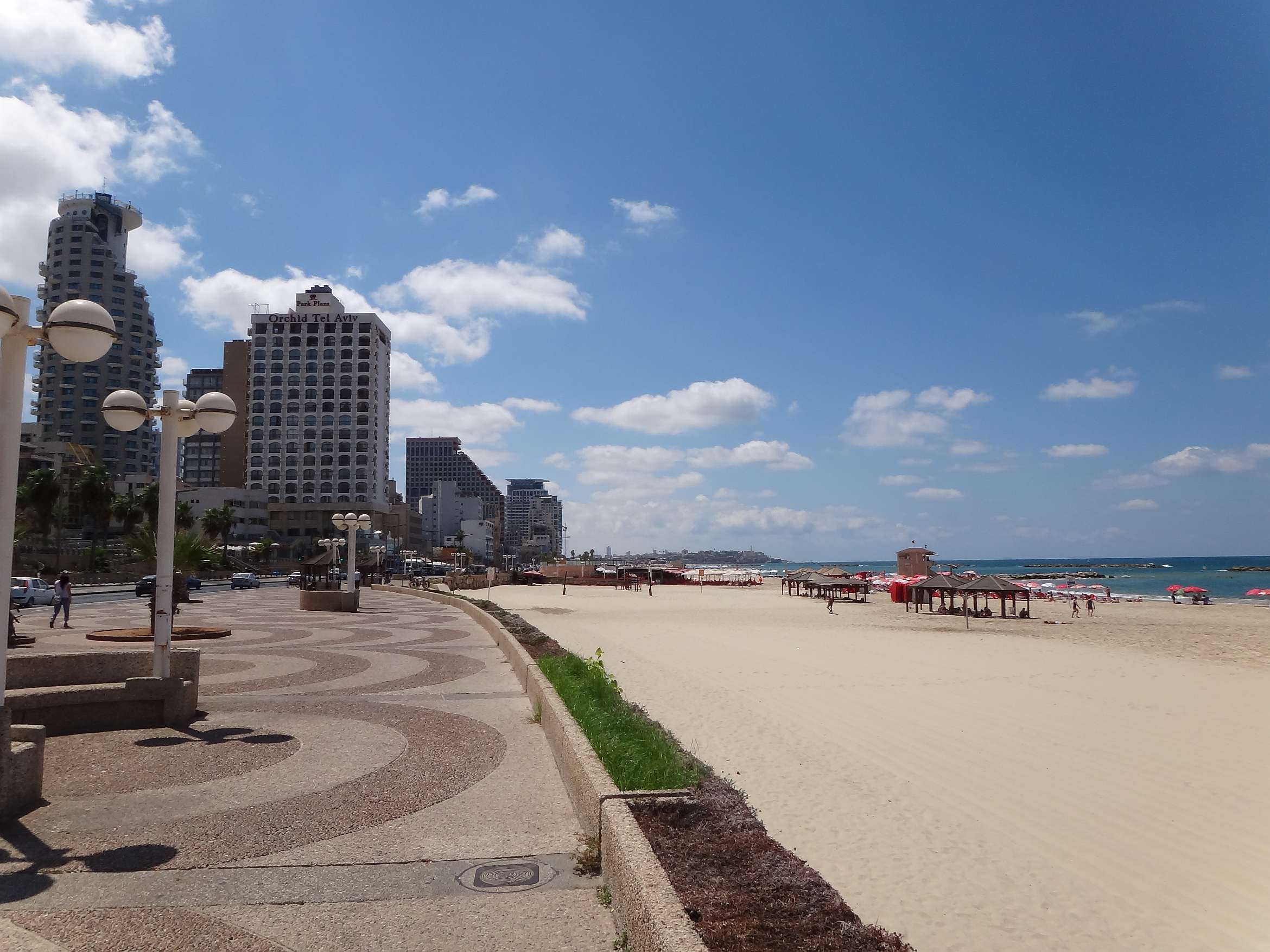 People relaxing along the Tel Aviv beach promenade